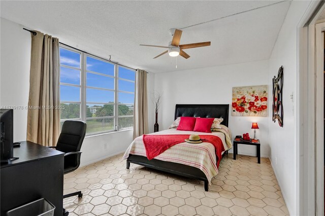 2671 S Course Dr Unit 409, Pompano Beach, FL 33069 - bedroom featuring tile patterned floors, baseboards, and ceiling fan