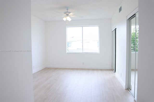 16686 Hemingway Dr Unit 16686, Weston, FL 33326 - unfurnished room with light wood finished floors, baseboards, a ceiling fan, and visible vents