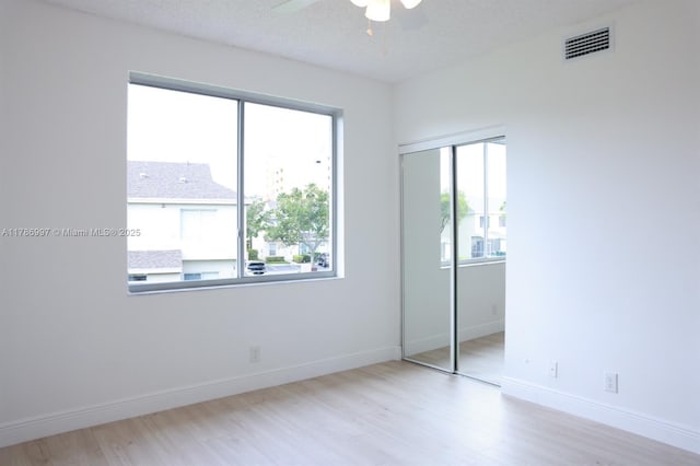 16686 Hemingway Dr Unit 16686, Weston, FL 33326 - unfurnished bedroom with wood finished floors, visible vents, a ceiling fan, a closet, and baseboards