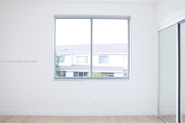 16686 Hemingway Dr Unit 16686, Weston, FL 33326 - unfurnished bedroom with light wood-style flooring, a closet, and baseboards