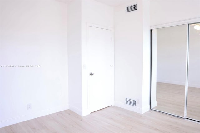 16686 Hemingway Dr Unit 16686, Weston, FL 33326 - unfurnished bedroom featuring baseboards, light wood finished floors, and a closet