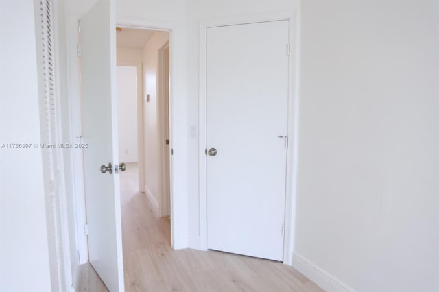 16686 Hemingway Dr Unit 16686, Weston, FL 33326 - hallway with baseboards and light wood finished floors