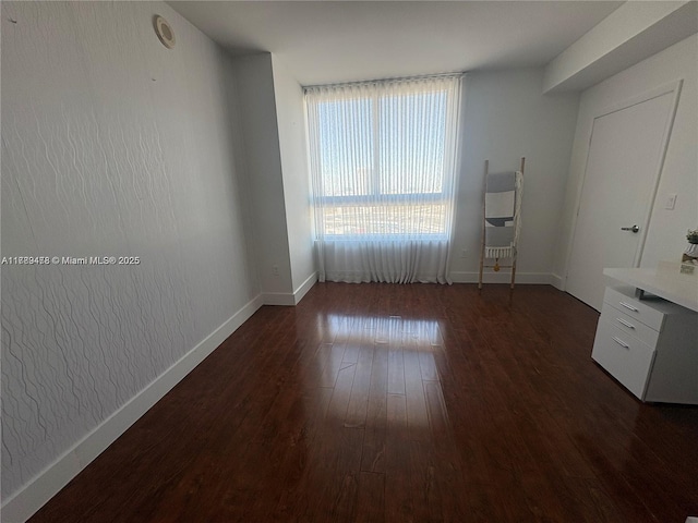 90 SW 3rd St Unit 2010, Miami, FL 33130 - unfurnished bedroom featuring baseboards and dark wood-type flooring