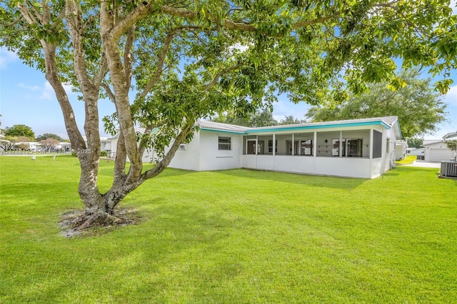 1171 NW 88th Way, Plantation, FL 33322 - back of house with a sunroom and a yard