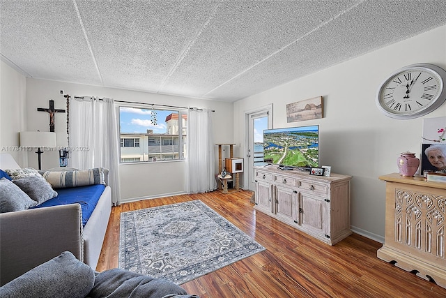 4500 N Flagler Dr Unit C24, West Palm Beach, FL 33407 - living area with wood finished floors and a textured ceiling