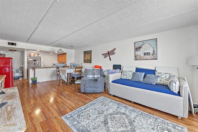 4500 N Flagler Dr Unit C24, West Palm Beach, FL 33407 - living area with visible vents, wood finished floors, and a textured ceiling