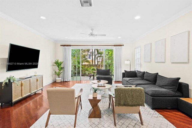 living area with recessed lighting, ceiling fan, visible vents, and ornamental molding