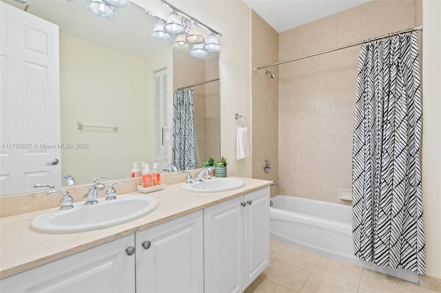 full bathroom featuring double vanity, shower / bathtub combination with curtain, tile patterned floors, and a sink