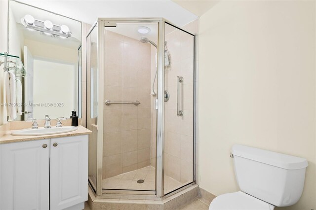 419 SW 5th St Unit 419, Fort Lauderdale, FL 33315 - bathroom featuring vanity, a stall shower, and tile patterned flooring