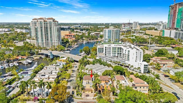 bird's eye view featuring a water view and a view of city