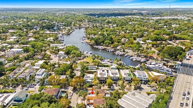 drone / aerial view with a residential view and a water view