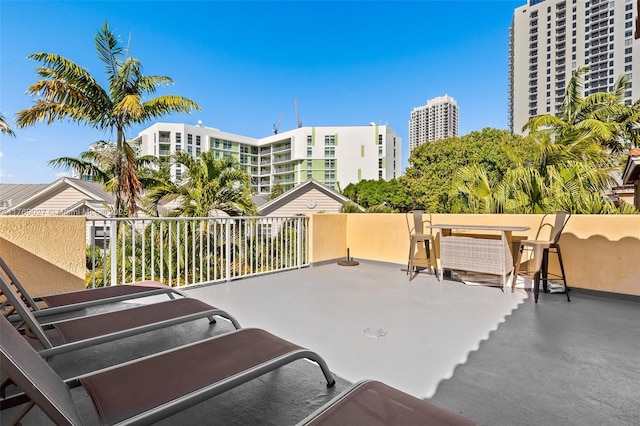 view of patio featuring a city view and a balcony