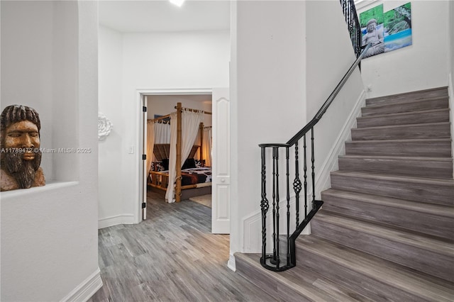 3007 W 8th St, Lehigh Acres, FL 33971 - stairs featuring wood finished floors and baseboards