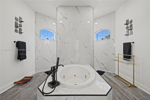 3007 W 8th St, Lehigh Acres, FL 33971 - bathroom featuring healthy amount of natural light, a whirlpool tub, and baseboards