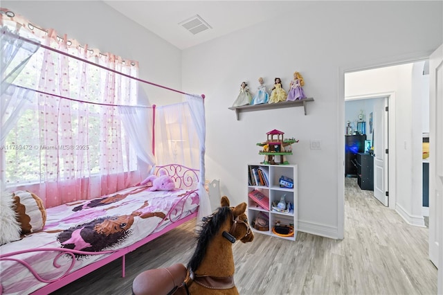 3007 W 8th St, Lehigh Acres, FL 33971 - bedroom featuring wood finished floors and baseboards