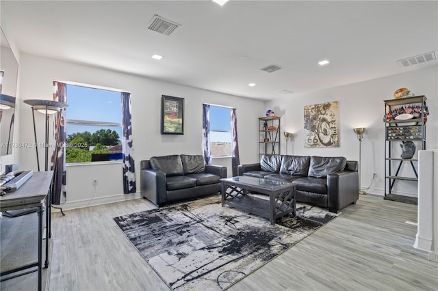 3007 W 8th St, Lehigh Acres, FL 33971 - living room featuring light wood-style floors, baseboards, and recessed lighting