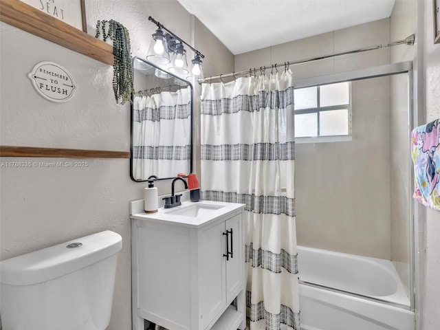 full bath featuring shower / tub combo, a textured wall, vanity, and toilet