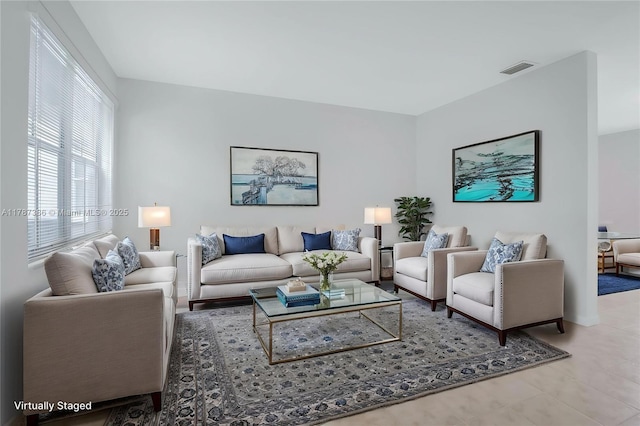 1042 Bluewood Ter, Weston, FL 33327 - living area featuring tile patterned flooring and baseboards