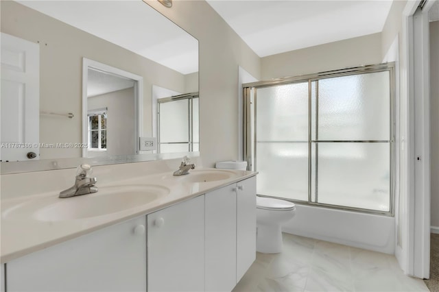 1042 Bluewood Ter, Weston, FL 33327 - full bathroom featuring toilet, healthy amount of natural light, double vanity, and bath / shower combo with glass door