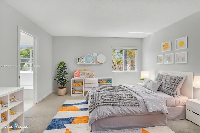 carpeted bedroom with multiple windows