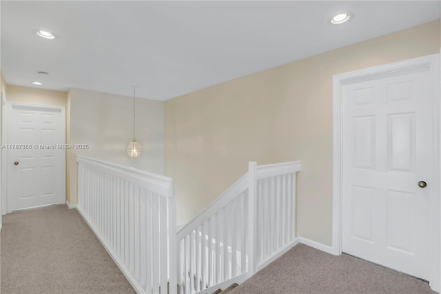 1042 Bluewood Ter, Weston, FL 33327 - hallway with an upstairs landing, carpet floors, recessed lighting, and baseboards