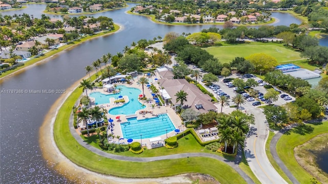 1042 Bluewood Ter, Weston, FL 33327 - drone / aerial view of a pool area and a nearby body of water