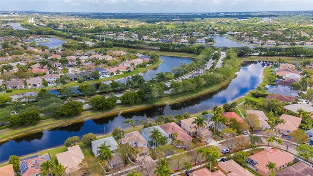 birds eye view of property featuring a water view and a residential view