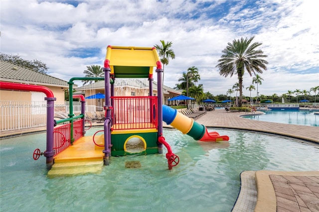 1042 Bluewood Ter, Weston, FL 33327 - communal playground featuring a water play area and a community pool