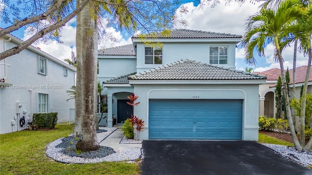 1042 Bluewood Ter, Weston, FL 33327 - mediterranean / spanish home with driveway, stucco siding, a garage, and a tiled roof