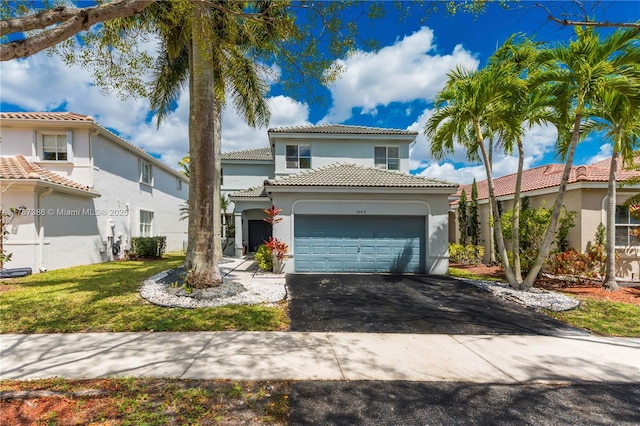 1042 Bluewood Ter, Weston, FL 33327 - mediterranean / spanish house featuring stucco siding, an attached garage, driveway, a tile roof, and a front lawn