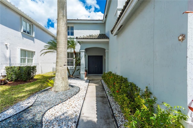 1042 Bluewood Ter, Weston, FL 33327 - property entrance featuring stucco siding and a tile roof