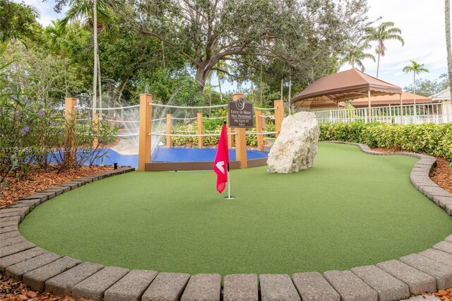 view of playground featuring a gazebo and fence