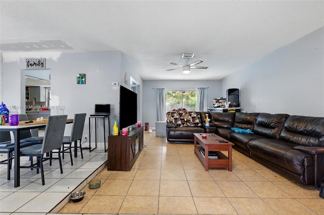 4210 NW 23rd St, Lauderhill, FL 33313 - living room with visible vents, a textured ceiling, a ceiling fan, and light tile patterned floors