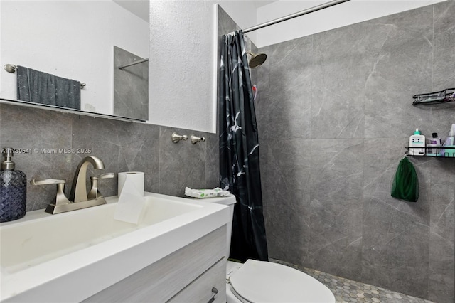 4210 NW 23rd St, Lauderhill, FL 33313 - full bath with a tile shower, toilet, vanity, and tile walls