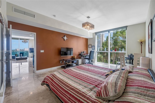 1945 S Ocean Dr Unit 401, Hallandale Beach, FL 33009 - bedroom with a chandelier, multiple windows, an office area, and floor to ceiling windows
