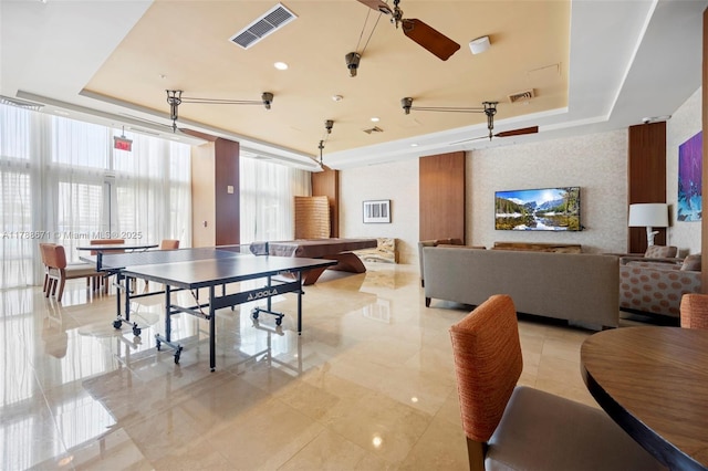 1945 S Ocean Dr Unit 401, Hallandale Beach, FL 33009 - rec room featuring a tray ceiling and light tile patterned flooring
