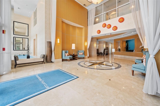 1945 S Ocean Dr Unit 401, Hallandale Beach, FL 33009 - building lobby featuring a towering ceiling and wooden walls
