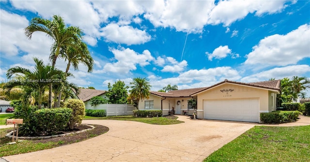 11430 NW 39th Ct, Coral Springs, FL 33065 - single story home with a tiled roof, fence, a garage, curved driveway, and stucco siding