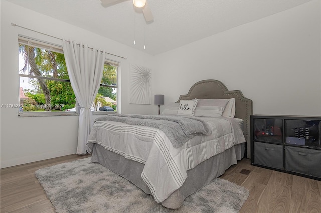 11430 NW 39th Ct, Coral Springs, FL 33065 - bedroom featuring wood finished floors, baseboards, and ceiling fan