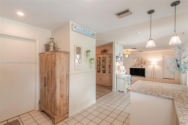 11430 NW 39th Ct, Coral Springs, FL 33065 - kitchen with open floor plan, light tile patterned floors, decorative light fixtures, visible vents, and recessed lighting