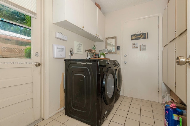 11430 NW 39th Ct, Coral Springs, FL 33065 - laundry room with cabinet space, independent washer and dryer, and light tile patterned floors