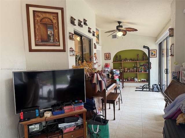 15357 SW 43rd Ter, Miami, FL 33185 - living area featuring ceiling fan, tile patterned flooring, lofted ceiling, and a textured wall