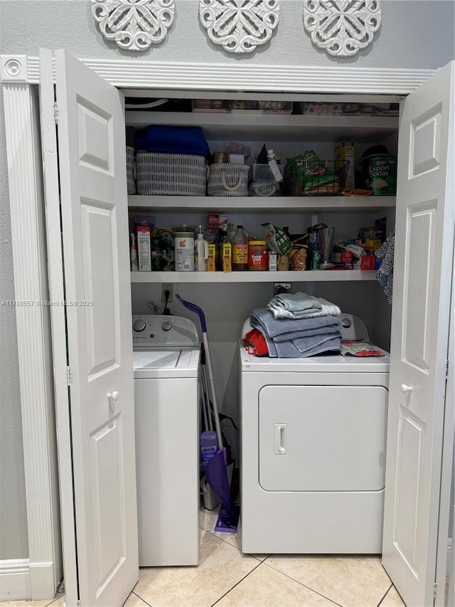 15357 SW 43rd Ter, Miami, FL 33185 - washroom with washer and clothes dryer and light tile patterned flooring