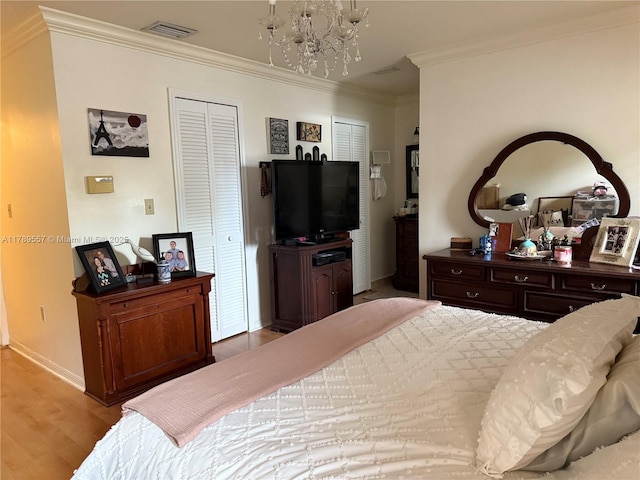15357 SW 43rd Ter, Miami, FL 33185 - bedroom with a chandelier, crown molding, baseboards, wood finished floors, and a closet
