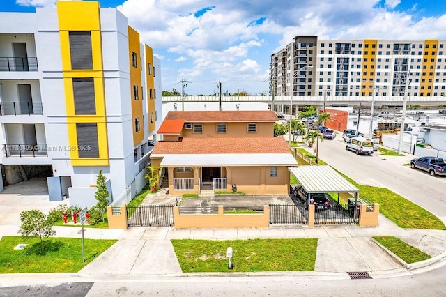 view of building exterior featuring a fenced front yard