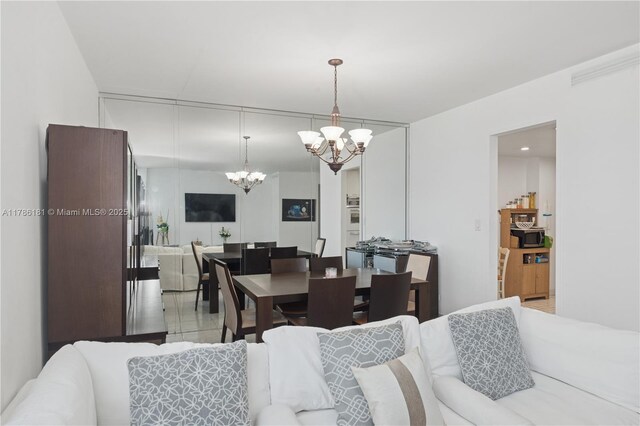 dining space featuring an inviting chandelier