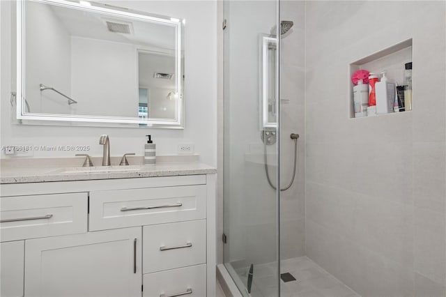 5055 Collins Ave Unit 5F, Miami Beach, FL 33140 - bathroom featuring tiled shower and vanity