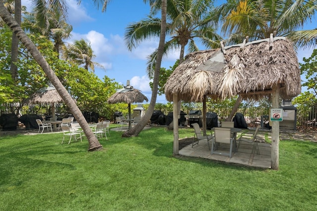 5055 Collins Ave Unit 5F, Miami Beach, FL 33140 - view of grassy yard with a patio area and a gazebo