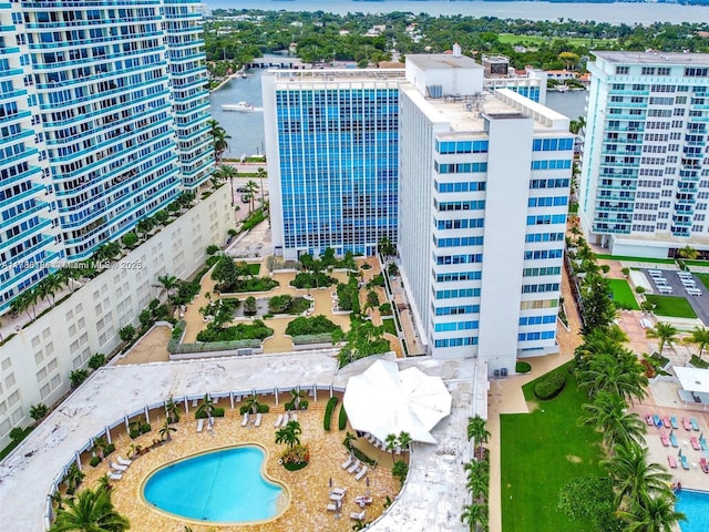 drone / aerial view featuring a view of city and a water view