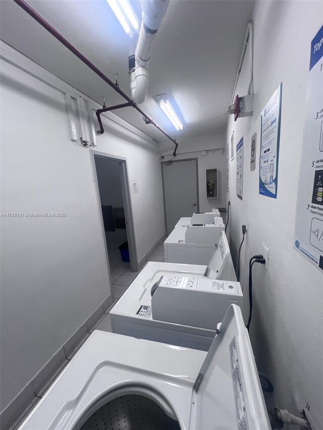 shared laundry area featuring independent washer and dryer